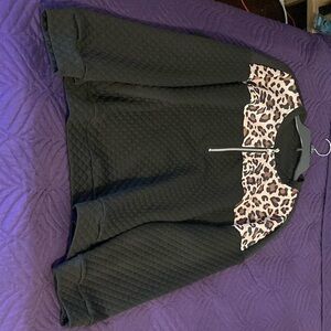 Women’s black sweater with cheetah print